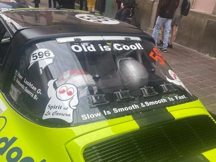 An old race car on the streets of Mexico getting ready for a competition