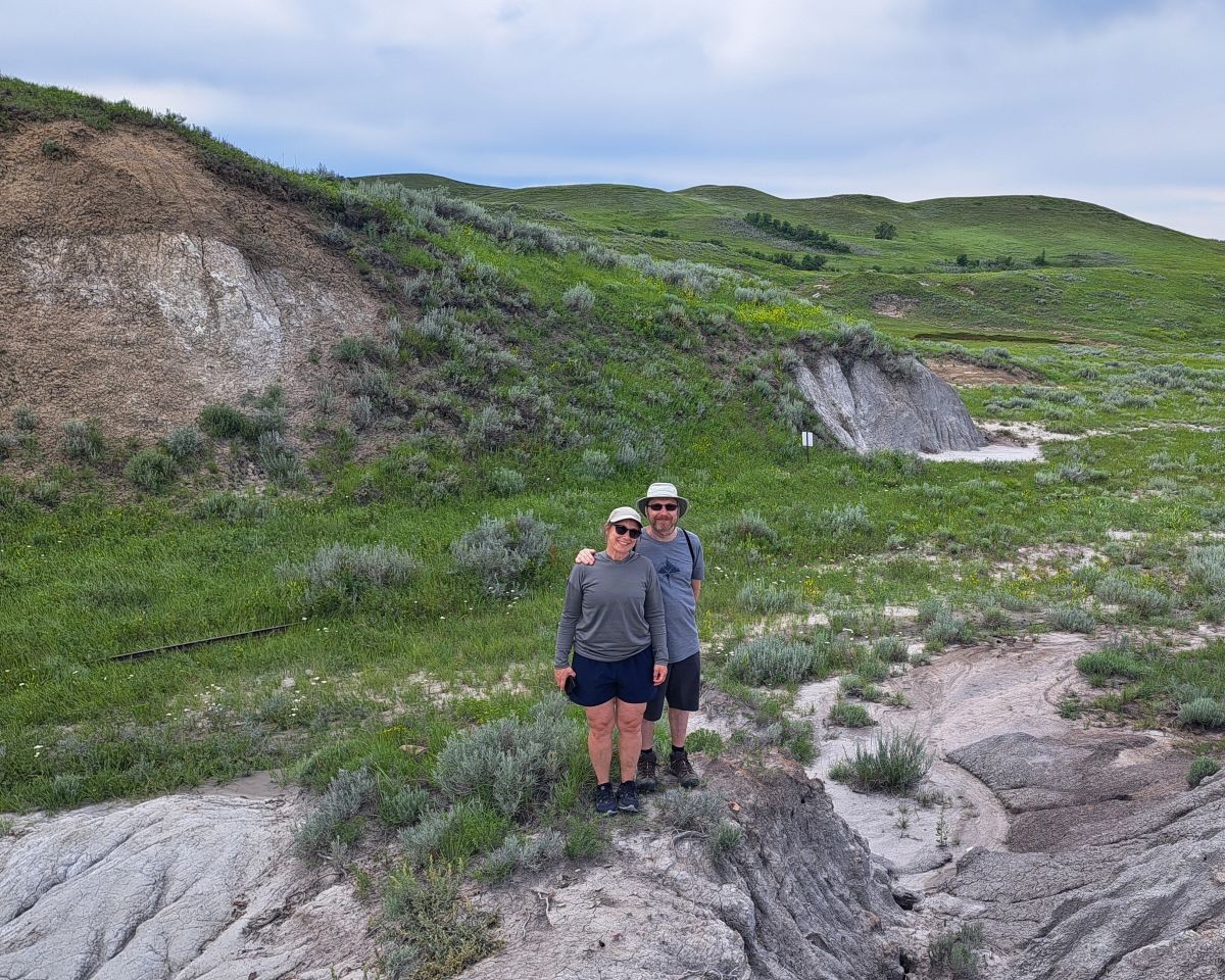 A couple of adventure seekers having fun exploring the clay pits at the Claybank Brick Plant Historic Site in SK