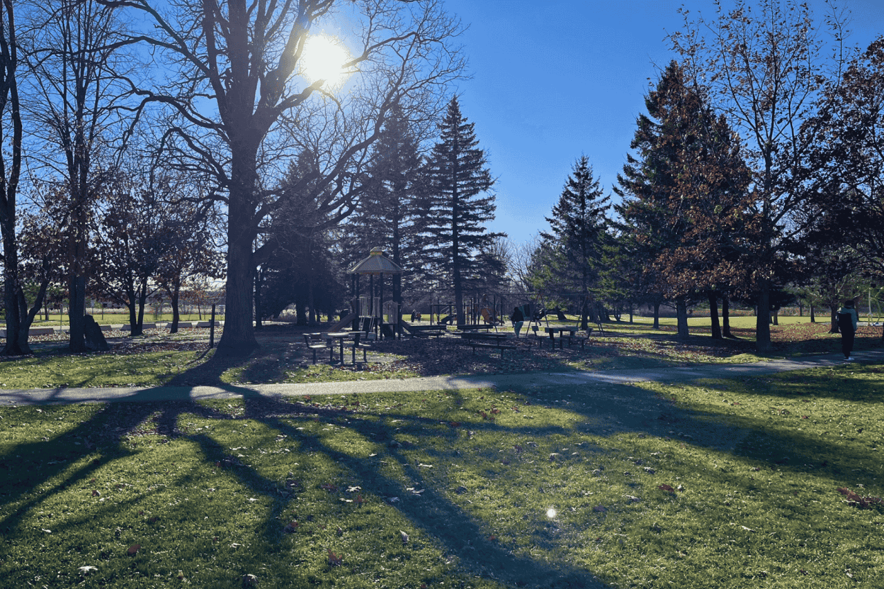 View from Walter Baker Park, Kanata, ON, from the Toboggan Hill, including the playground and walking paths.