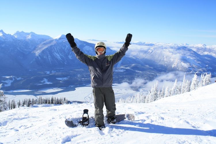 Snowboarding and skiing on Revelstoke Mountain in the Interior of British Columbia Canada. Revy is Top 10 Best Winter Small Towns for Adventures in Canada.