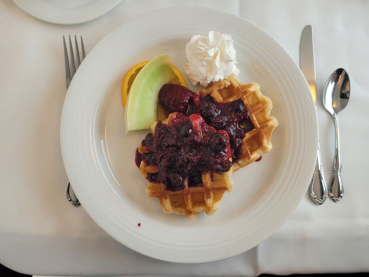 Waffles with fresh berries, pancakes with syrup, or bacon and eggs were among the breakfast dishes served aboard Via Rail's The Canadian.