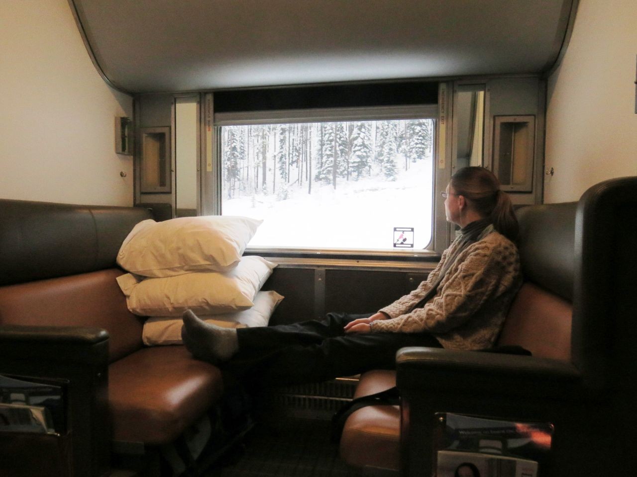 Upper and lower berth in Sleeper Class offer cozy beds at night and comfy benches during the day on board Via Rail's The Canadian.