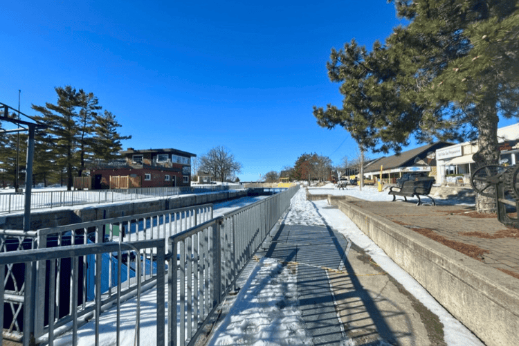 Shops and cafes in the distance overlooking Lock 34 at Fenelon Falls, Ontario, part of the Trent-Severn Waterway.