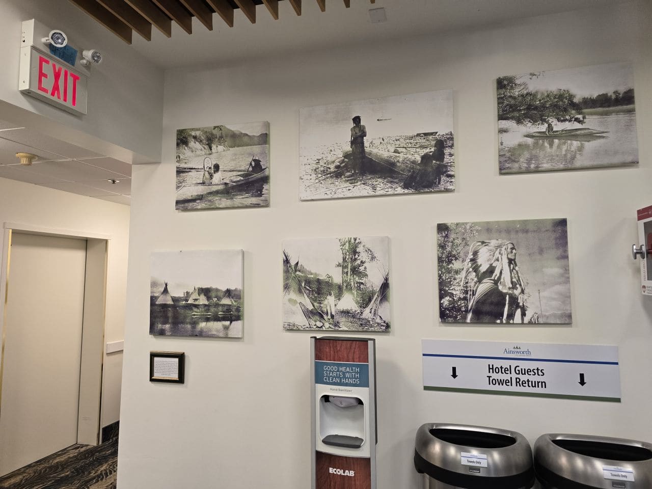 Historic photos line the walls of the Ainsworth Hotsprings pool lobby area upon entering the building.