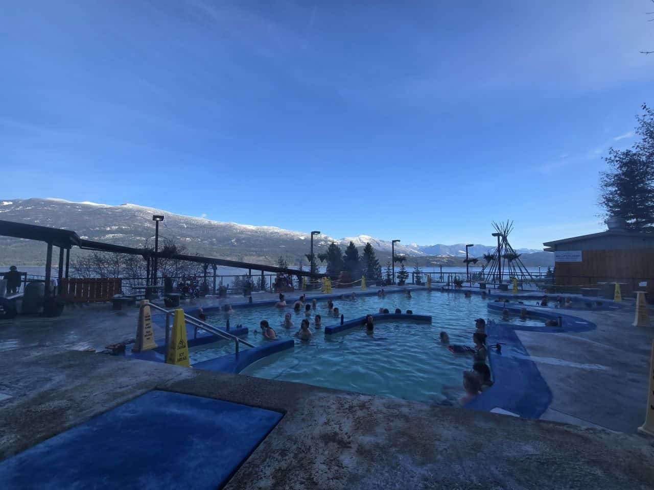 Winter Road Trip to Ainsworth Hotsprings in British Columbia Canada. The larger hotspring pool at Ainsworth Hotsprings Resort overlooking Kootenay Lake in British Columbia Canada