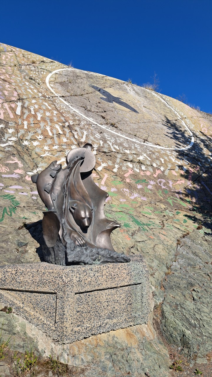 Cultural Crossroads - Cultural Crossroads on McAvoy Rock was a collaboration between the Metis, Dene, Inuvialuit, English, and French. There are hundreds of colourful handprints etched into the rock along with the phrase, "The Power of Working together" written in all 11 official languages of the Northwest Territories. 