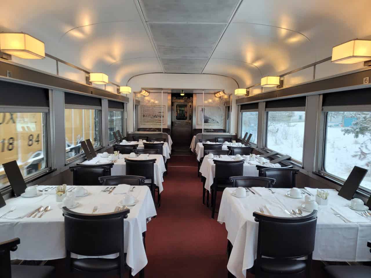 Dine in Style Aboard Via Rail's The Canadian - Prestige and Sleeper Class passengers enjoy three meals a day in the formal dining car aboard Via Rail's Canadian which features white table linen and fine China.