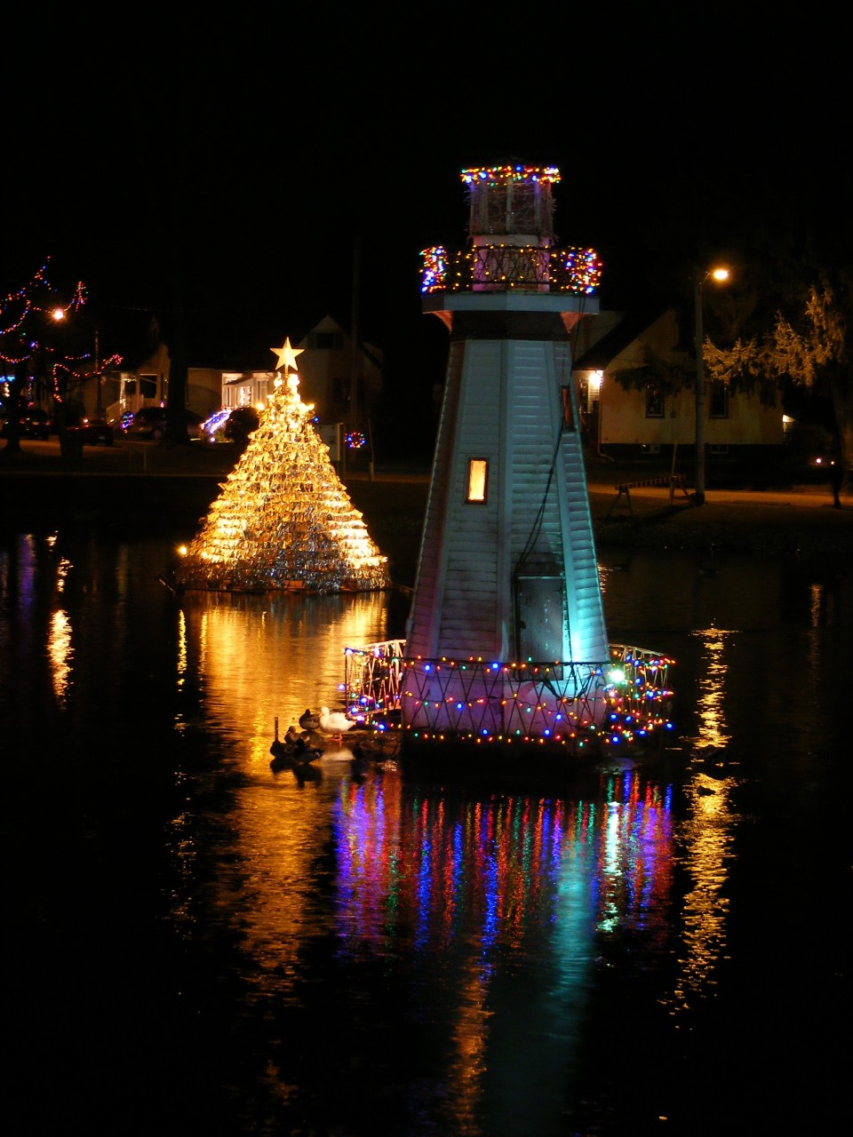 Simcoe Lighthouse Decked Out in Holiday Colours - Not to be outdone by the hundreds of dazzling Christmas light displays that decorate Wellington Park during the Simcoe Christmas Panorama, the Simcoe Lighthouse sports its own colours each evening.