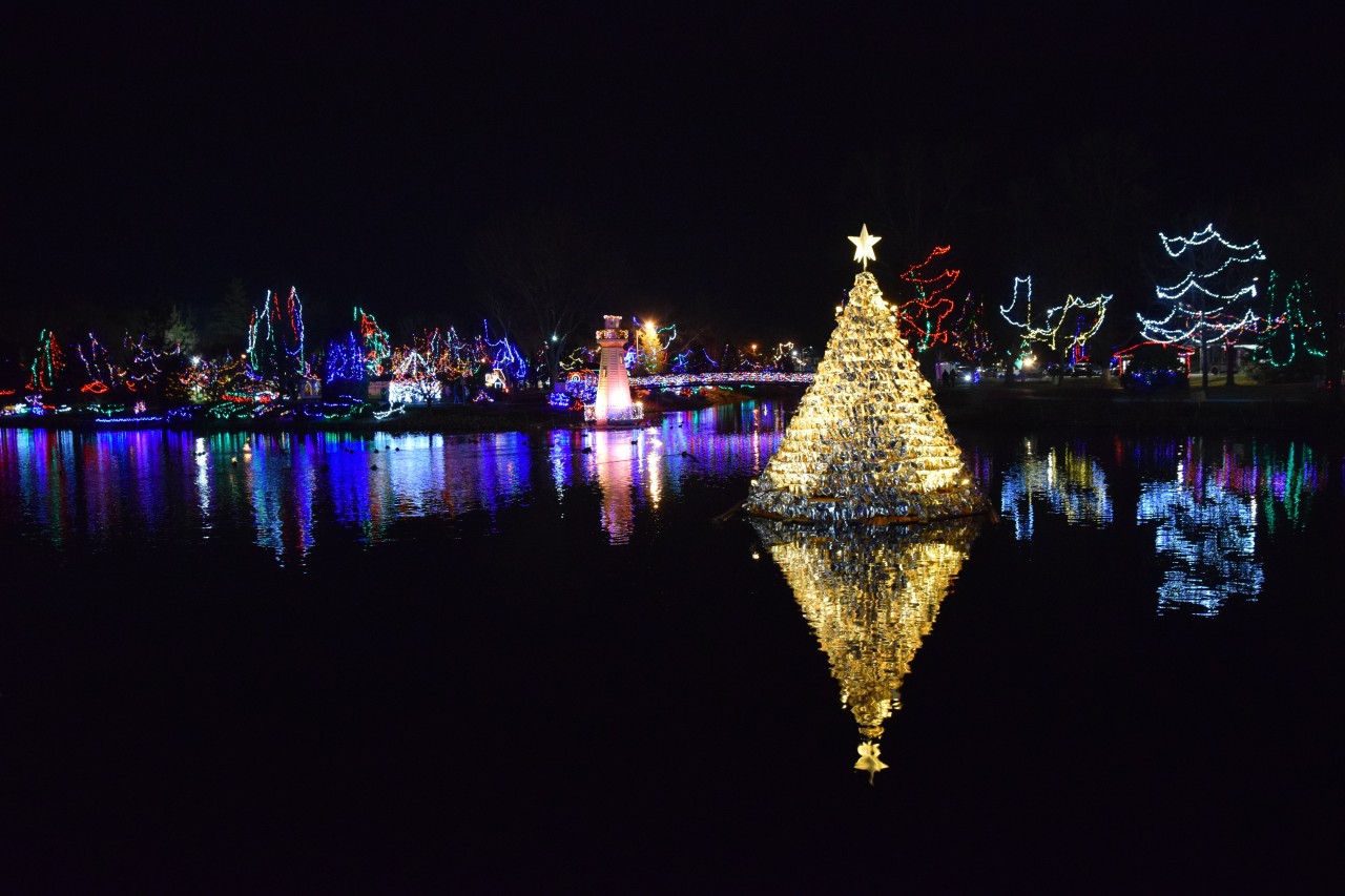 Christmas Tree Lights up Crystal Lake at the Simcoe Christmas Panorama - A spectacular golden Christmas tree sparkles in midst of the dark waters of Crystal Lake, creating a festive centerpiece to Simcoe's Christmas Panorama