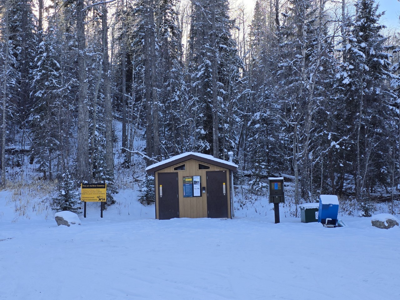 Bathrooms at Mitchell Lake in Alberta Canada  - Near the day use area and hand launch boat launch, there is a set of pit vault toilets. 