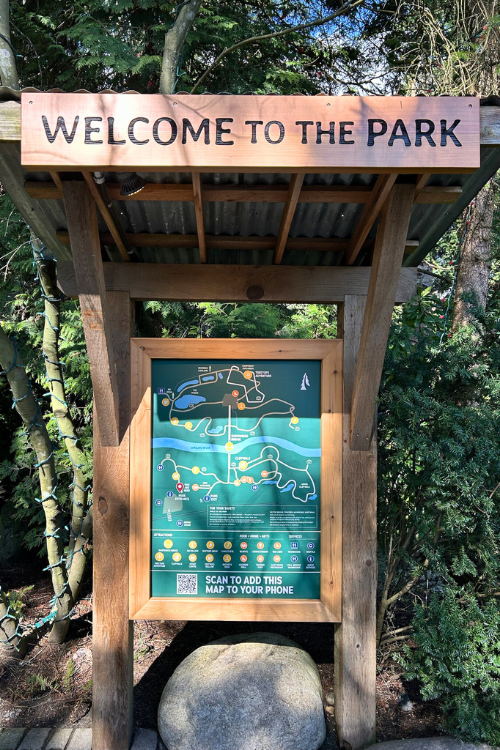 A Warm Welcome to the Capilano Suspension Bridge Park - "Welcome to the Park" signpost greets visitors upon arrival to the Capilano Suspension Bridge Park in North Vacouver.